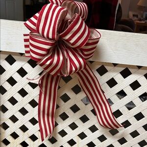 Festive Red and White Striped Holiday Bow